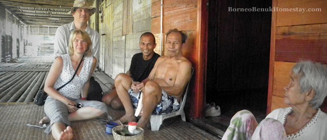 Visitors mixing with locals at Kampung Benuk longhouse